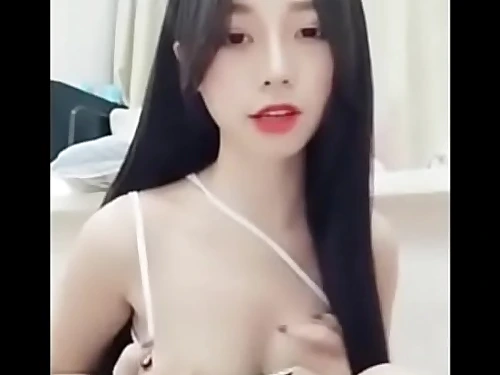 Luxurious chinese chick on smartphone