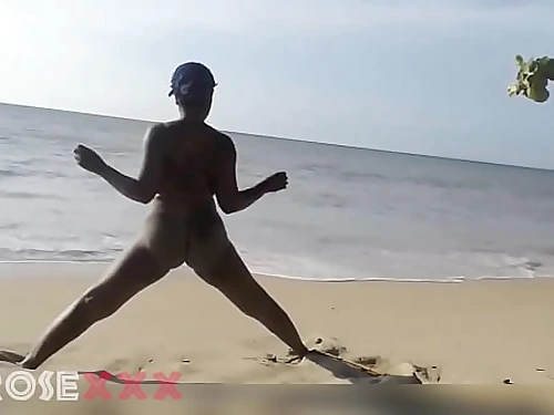 Ebony woman doing some workout nude on the beach